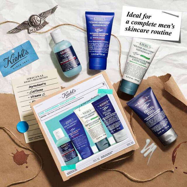 The Grooming Collection Gift Set on top of paper with elements scattered around​