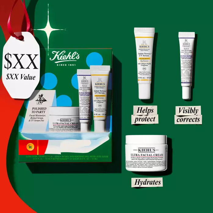 A Kiehl's holiday gift set featuring Ultra Facial Cream, UV Serum, and Retinol Serum, displayed with a promotional price tag against a green background.​