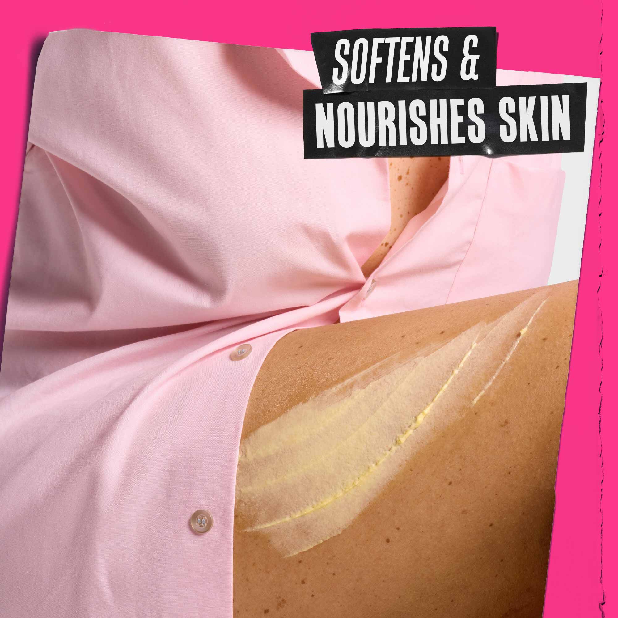 Close-up of cream swiped across skin beneath pink fabric, with promotional text stating it softens and nourishes skin.​