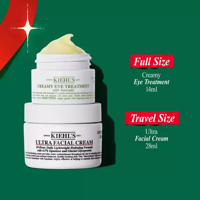 Kiehl's holiday promotional image showing a full-size Creamy Eye Treatment with Avocado and a travel-size Ultra Facial Cream stacked against a green background with a red starburst accent.​