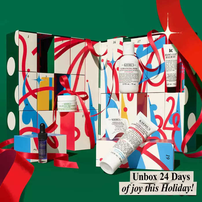 Kiehl’s holiday advent calendar box with festive artwork; promotional text says, “Unbox 24 Days of joy this Holiday!”​