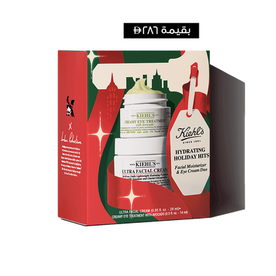 Hydrating Holiday Hits" skincare gift set on a green background, featuring Ultra Facial Cream and Creamy Eye Treatment with Avocado in festive packaging.​