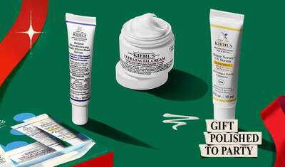 A Kiehl's holiday gift set featuring Ultra Facial Cream, Retinol Serum, and UV Serum, displayed alongside a festive red ribbon and promotional price tag.