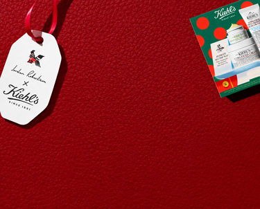 Kiehl's 2026 holiday gift guide promotional banner featuring category buttons for bestsellers, suncare, moisturizers, men's products, and services against a red background.​  ​