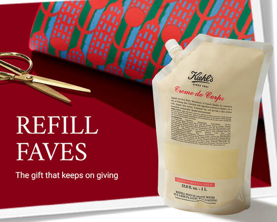 Kiehl's promotional banner featuring a body lotion refill pouch and gold scissors against a red background. 